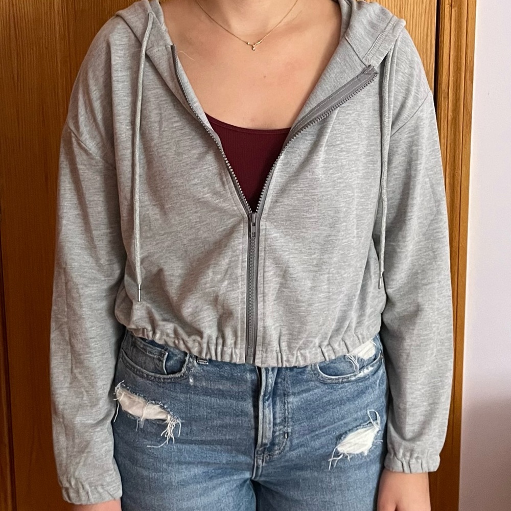 Grey zip up hoodie.